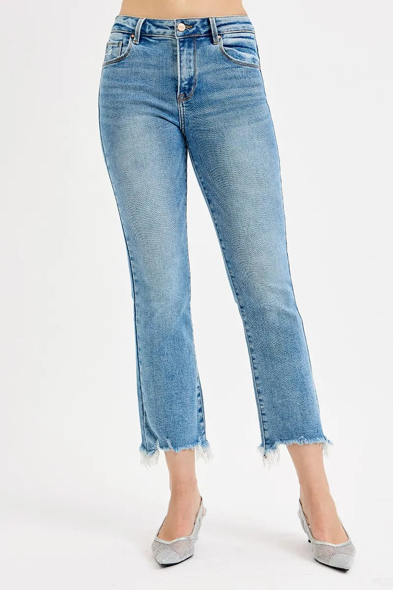 Light blue jeans worn by a person on a white background