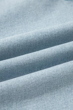 Close-up of light blue fabric with visible texture