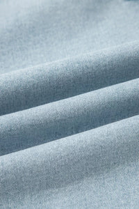 Close-up of light blue fabric with visible texture