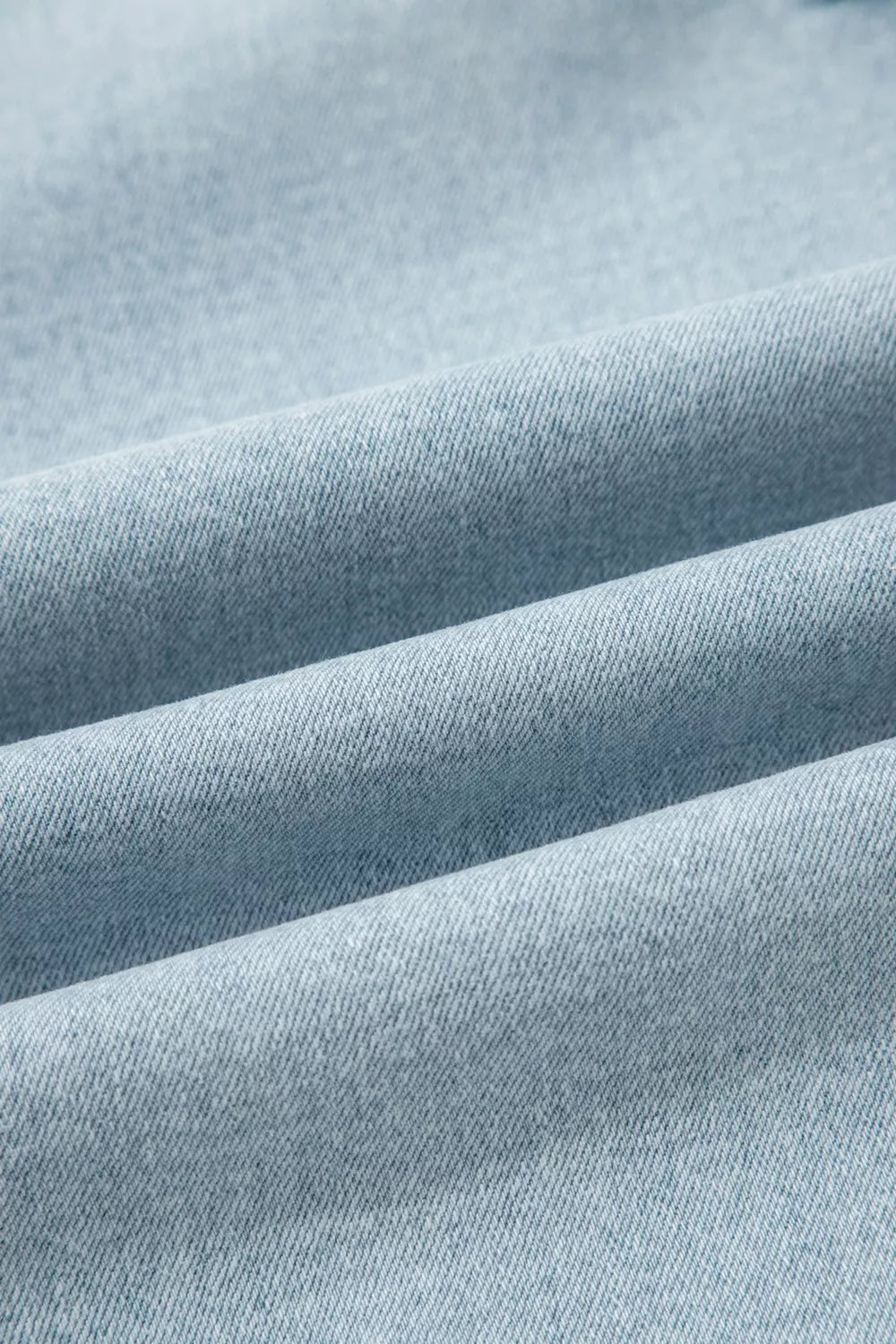 Close-up of light blue fabric with visible texture