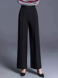 Black wide-leg pants worn by a person on a gray background