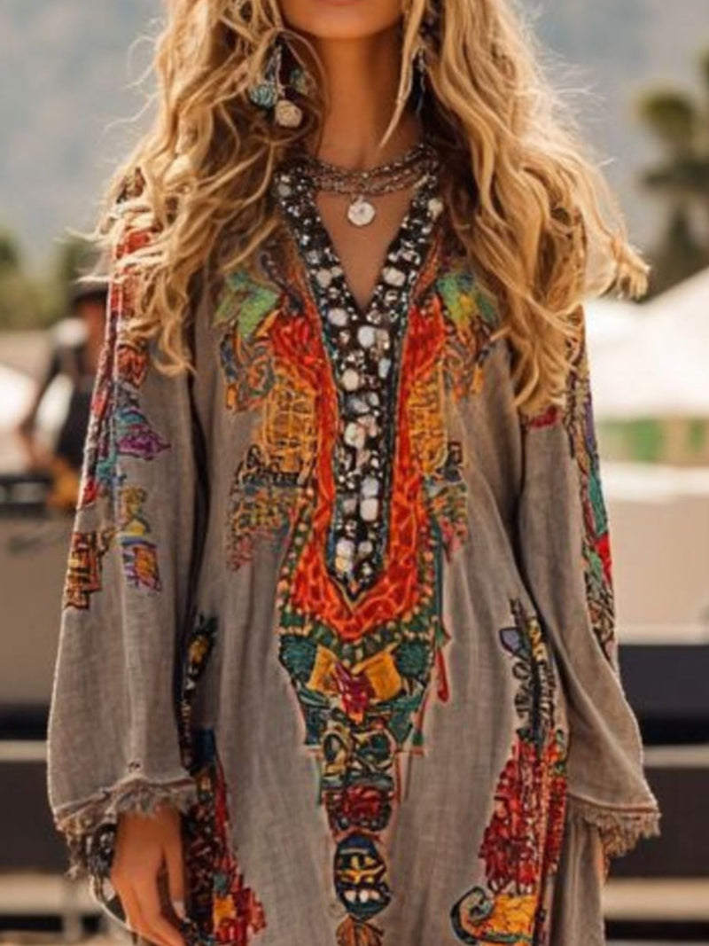 Colorful embroidered dress with intricate patterns worn by a person outdoors.