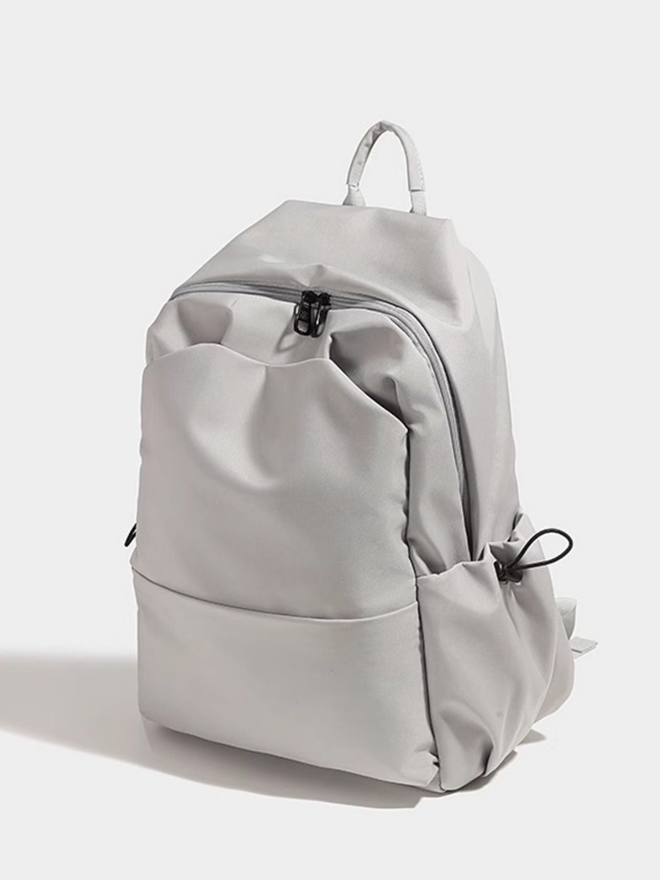 Light gray backpack on a white background