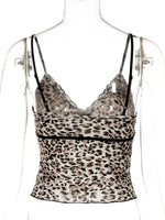 Leopard print top on a mannequin with a white background