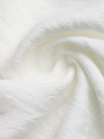 Close-up of white fabric with a soft texture