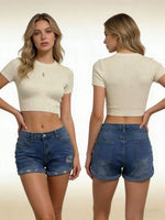 Woman wearing a cream crop top and blue denim shorts, shown from front and back.