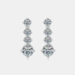 Pair of diamond earrings on a light gray background