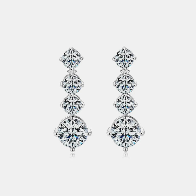 Pair of diamond earrings on a light gray background
