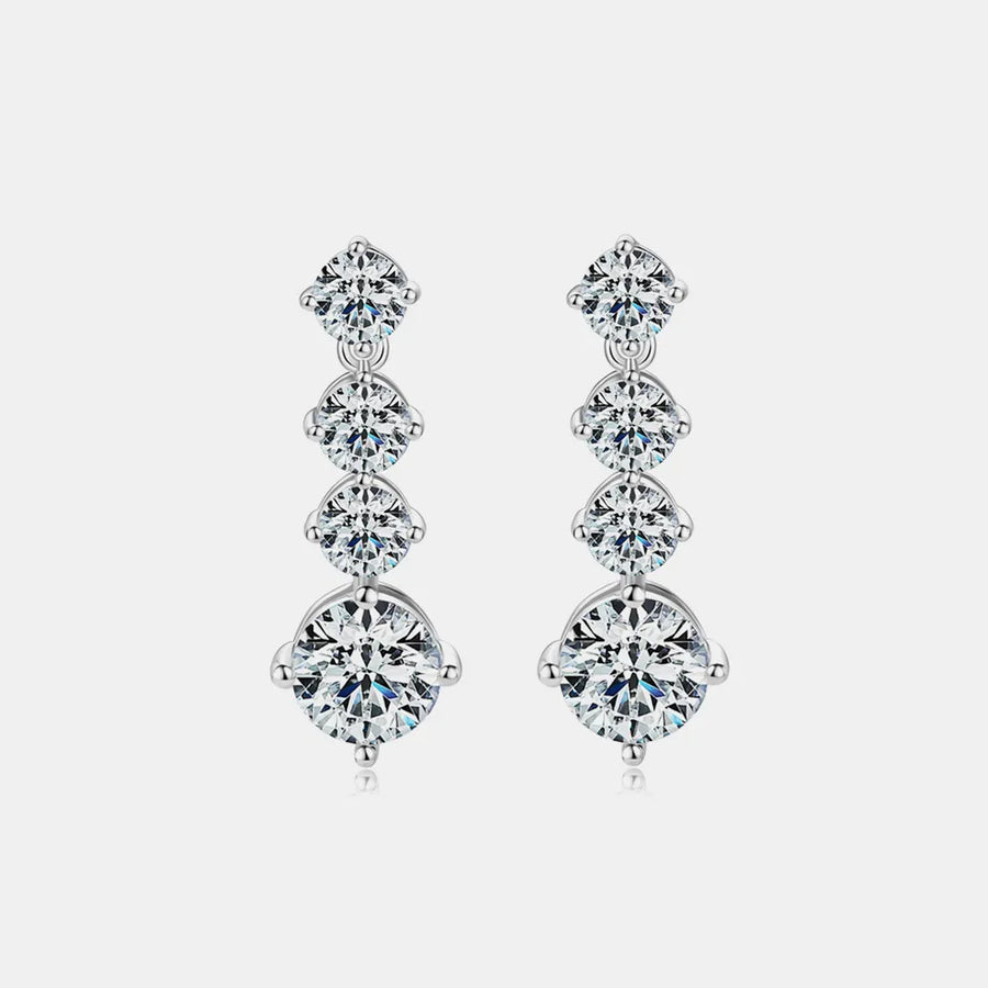 Pair of diamond earrings on a light gray background