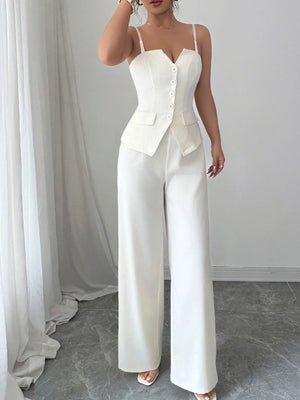 White jumpsuit with a blazer top worn by a person against a neutral background