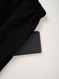 Black fabric and black mat on a white surface