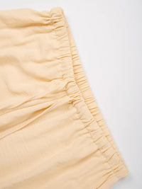 Close-up of a yellow shorts on a white background