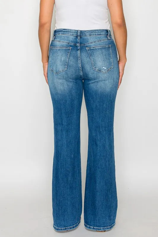 Blue jeans worn by a person on a white background