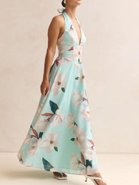 Woman wearing a floral dress with a light blue background