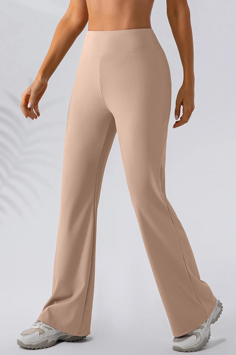 Beige pants worn by a person on a light gray background