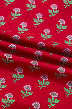 Red fabric with pink and green floral pattern