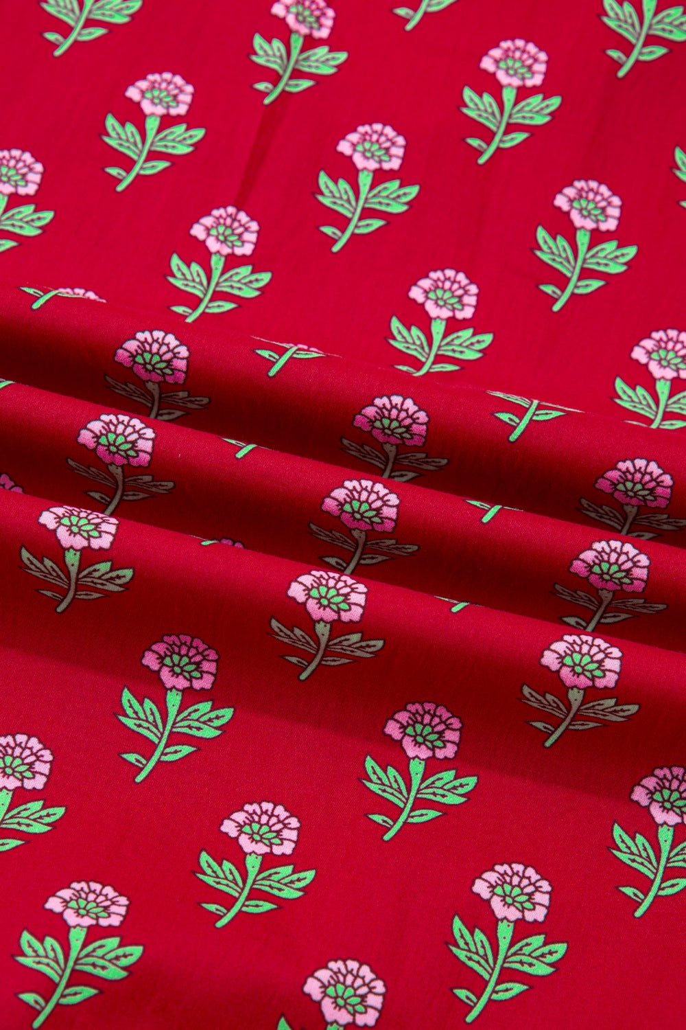 Red fabric with pink and green floral pattern