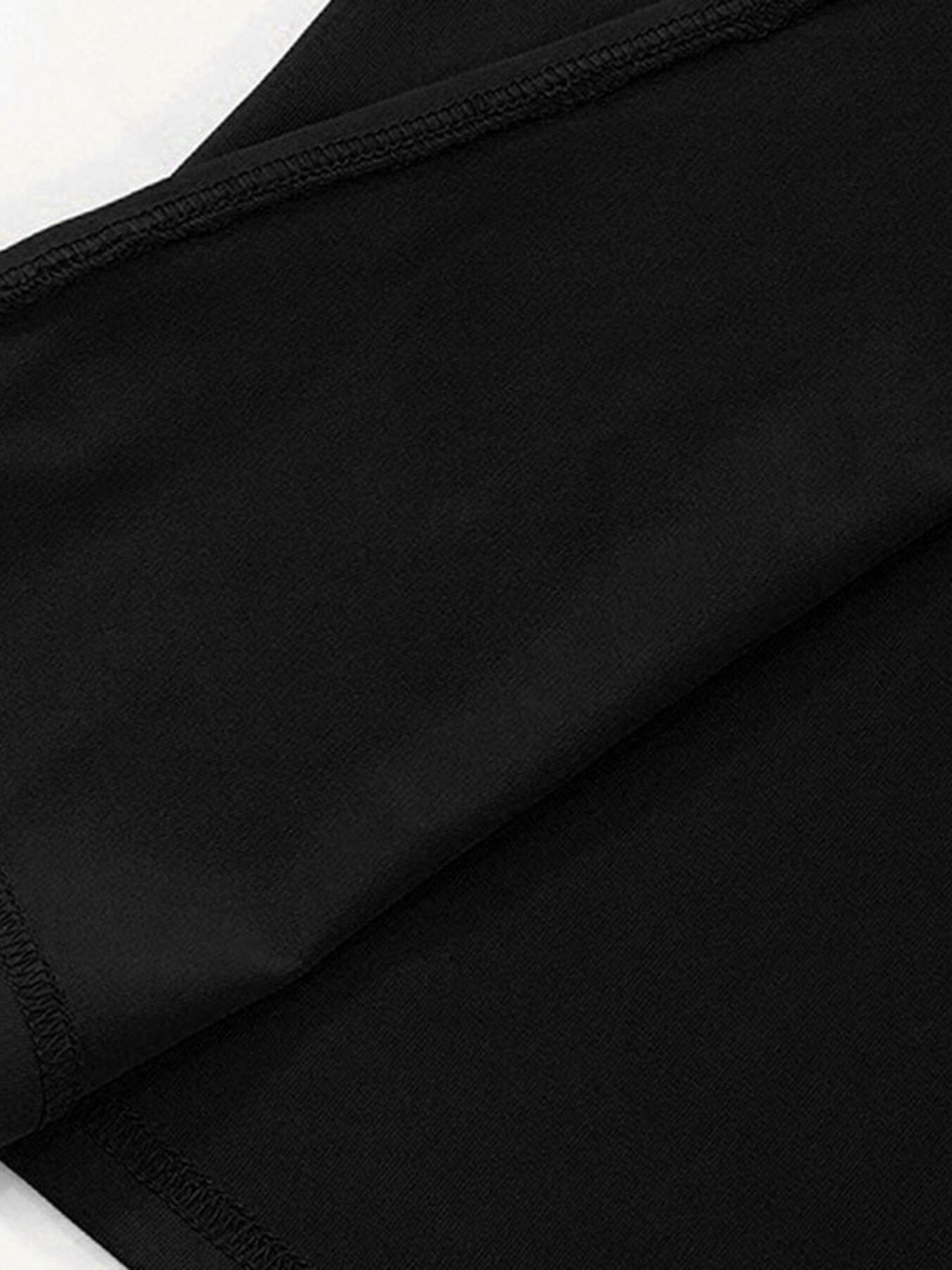 Close-up of black fabric with a white background