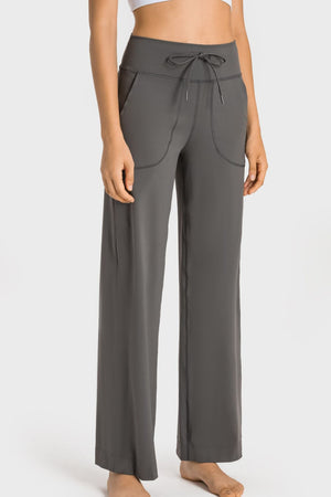 Gray wide-leg pants with a drawstring waist on a white background