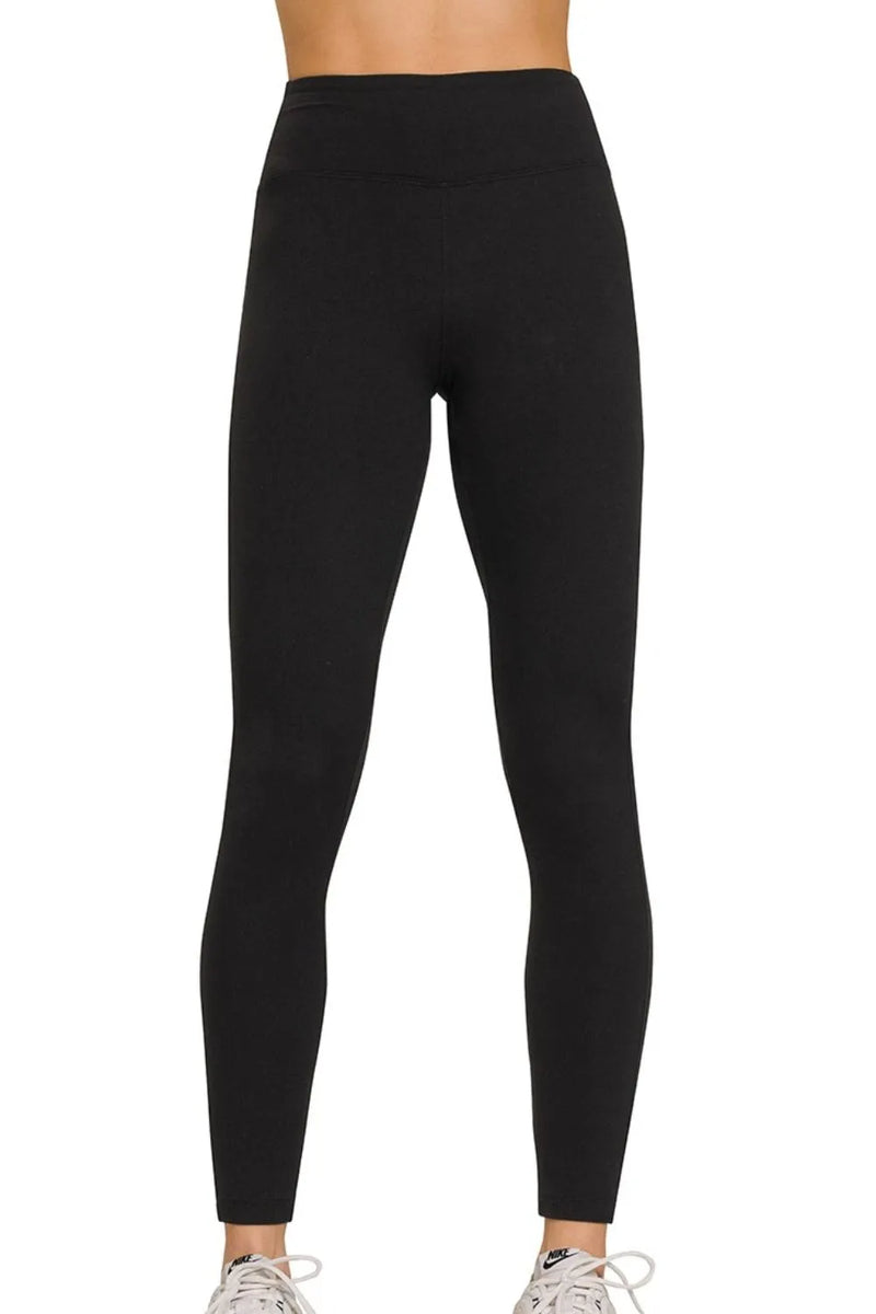 Black leggings worn by a person on a white background