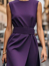 Purple dress worn by a person with a blurred city street background
