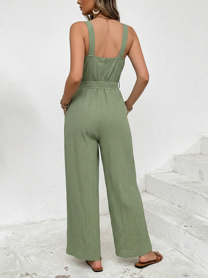 Woman wearing a green jumpsuit on a white background