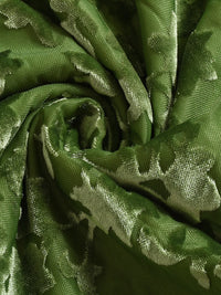 Close-up of green fabric with a subtle pattern