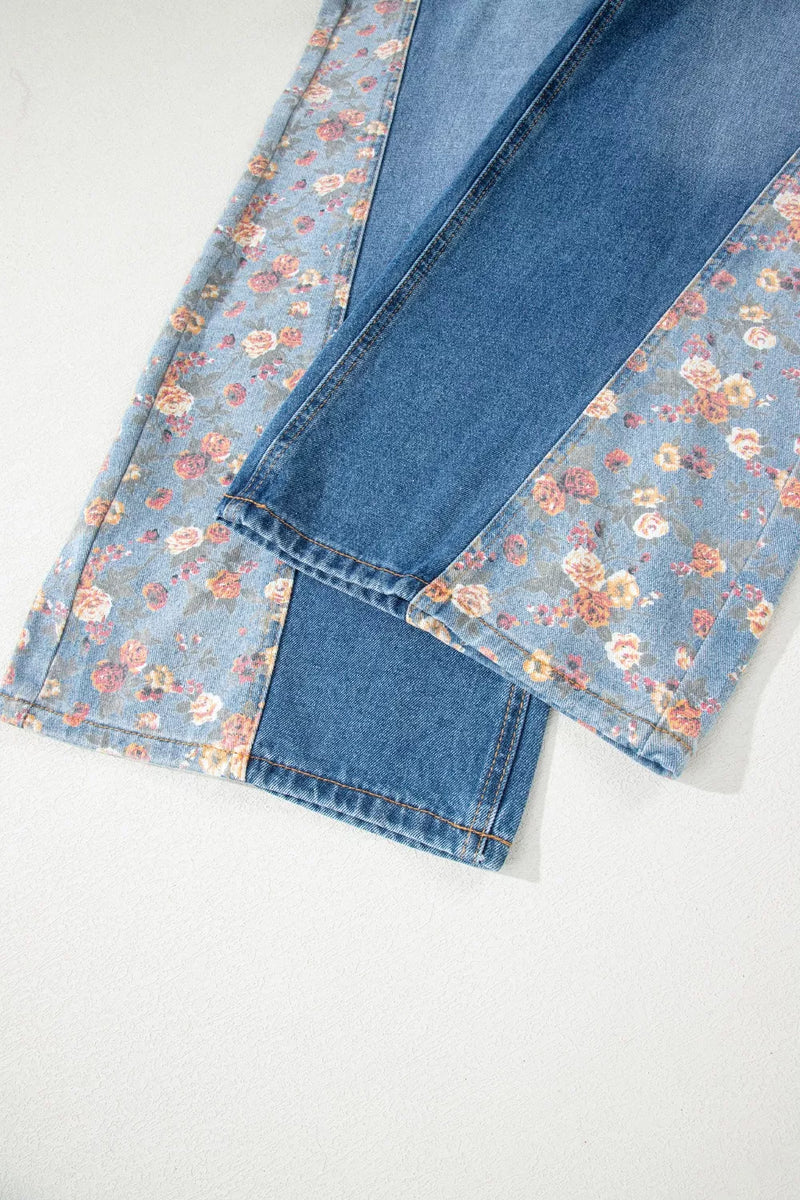 Folded denim fabric with floral pattern on a white background