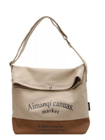 Beige and brown handbag with 'Aimanqi canuas. market' branding on a white background