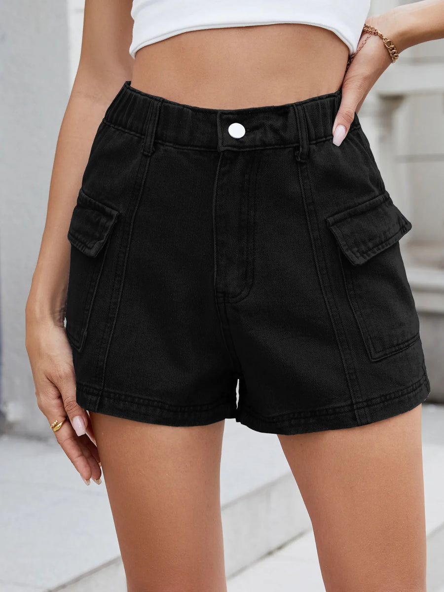 Black cargo shorts worn by a person on a neutral background