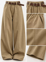 Wide-leg khaki pants with an elastic waistband and a brown belt, shown with detail inset images highlighting the fabric texture, belt buckle, side pocket, and hem stitching.