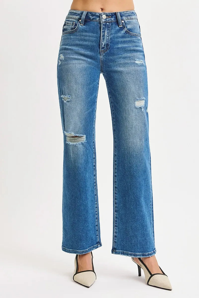 Blue distressed jeans on a white background