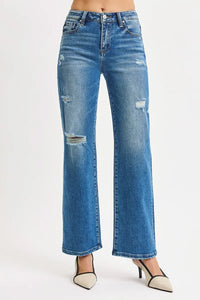Blue distressed jeans on a white background