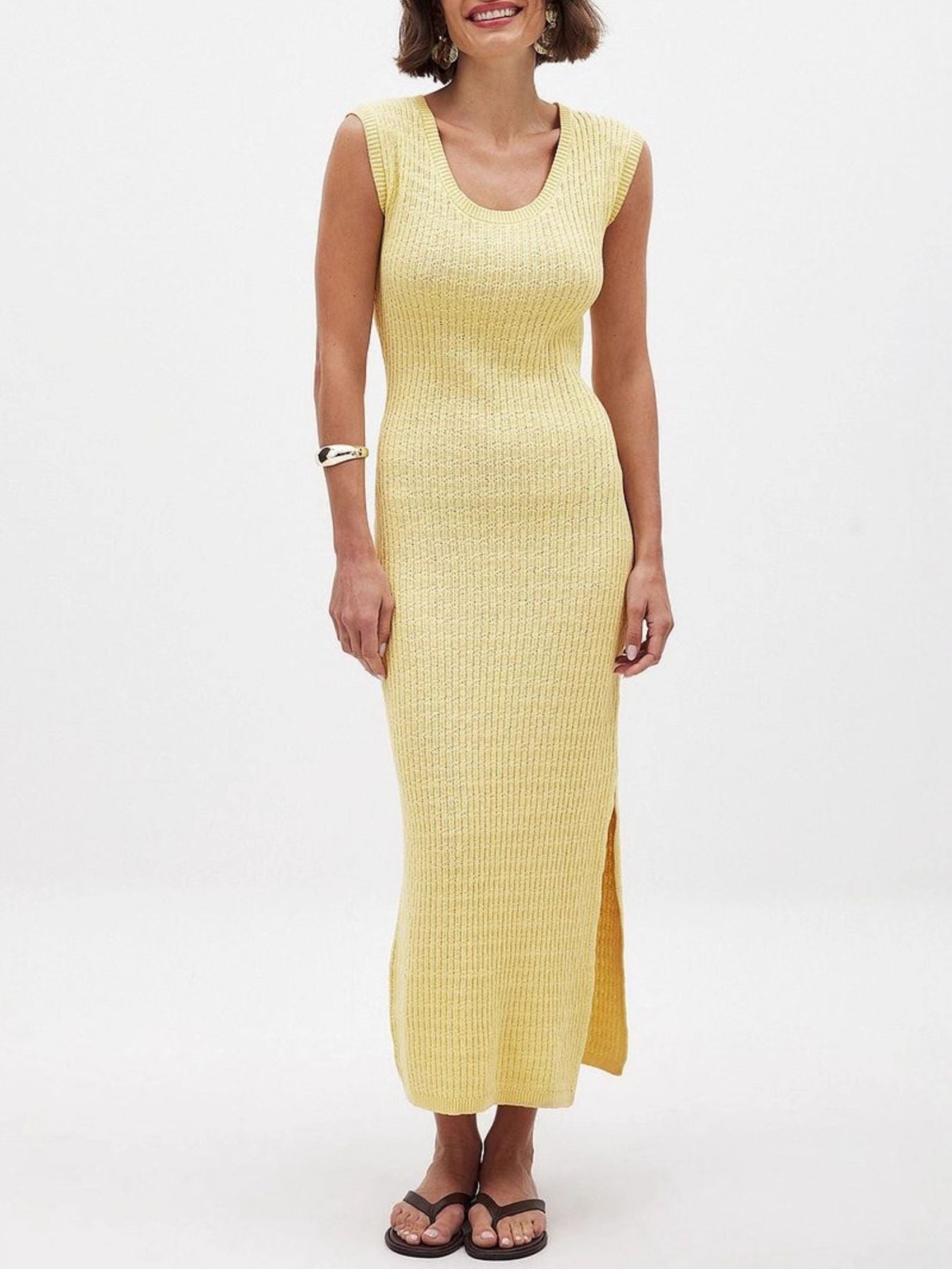Woman wearing a yellow dress on a white background