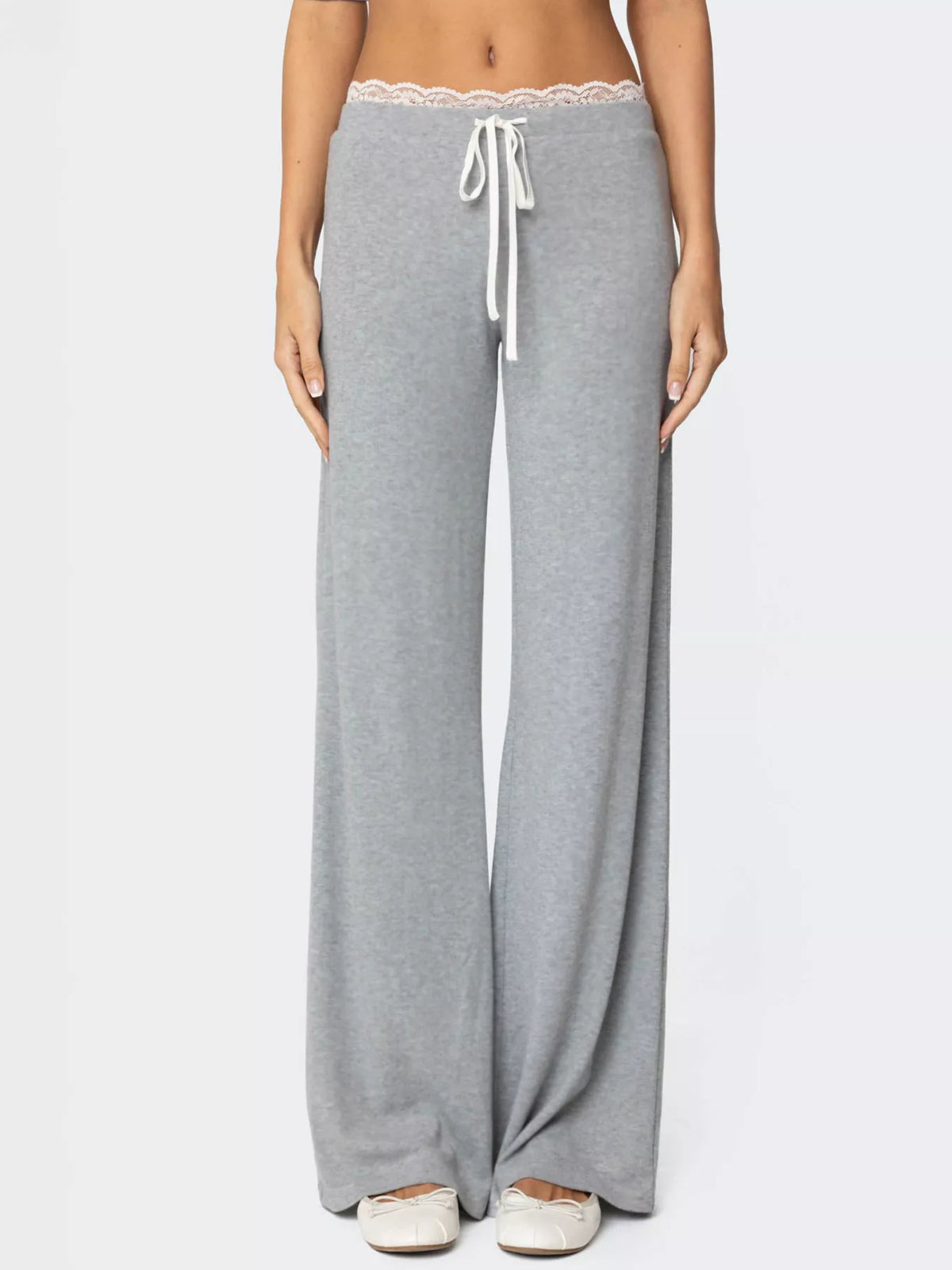 Gray wide-leg pants with lace waistband on a white background