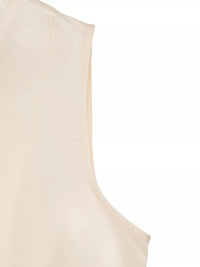 Beige sleeveless top on a white background