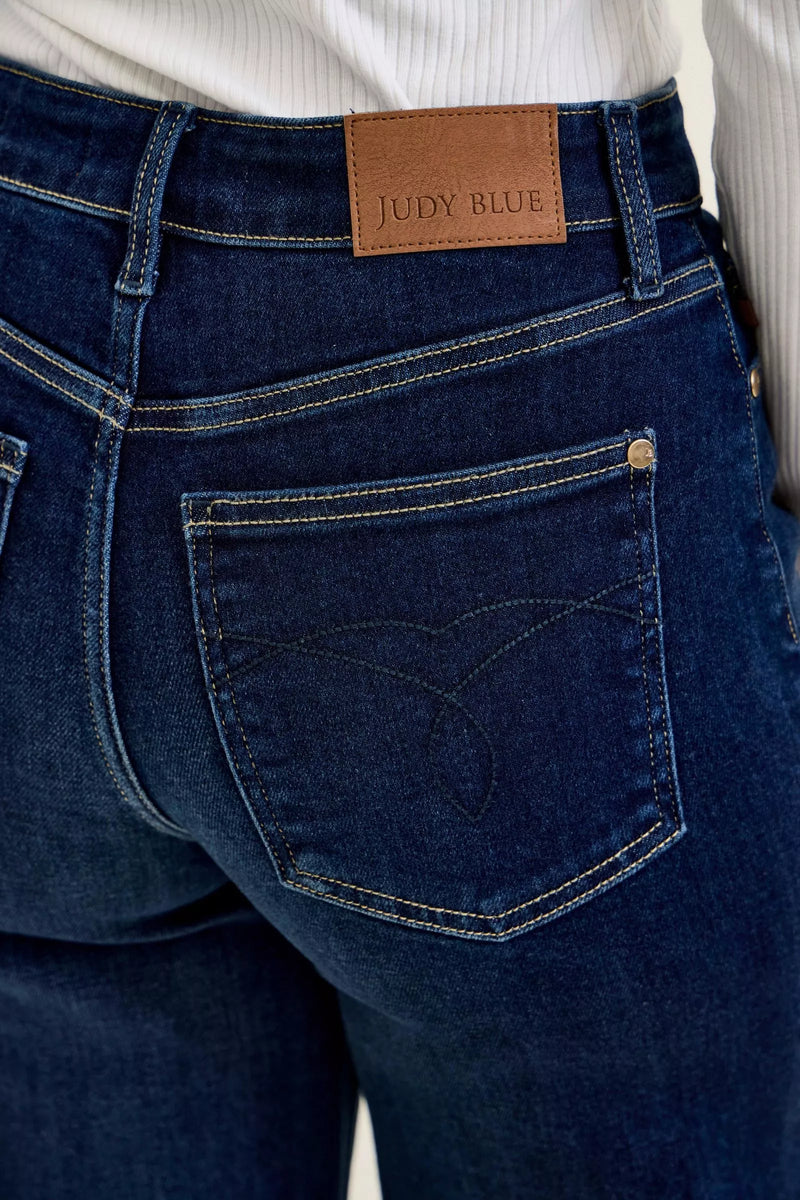 Close-up of blue jeans with a Judy Blue label on the waistband.