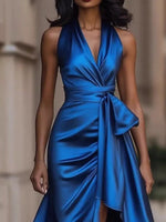 Woman wearing a blue dress with a blurred background