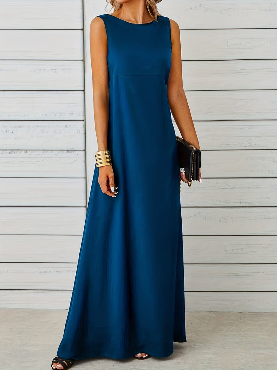 Woman wearing a long blue dress against a wooden background