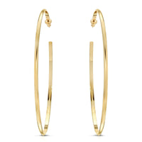 A pair of gold-colored hoop earrings with a domed shape, displayed against a white background.