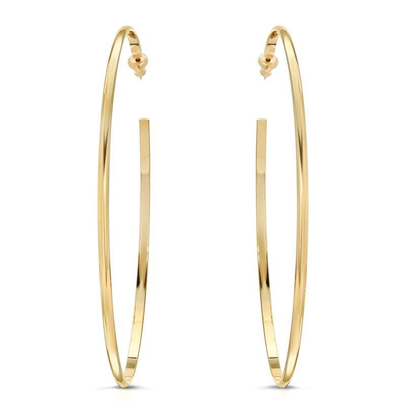 A pair of gold-colored hoop earrings with a domed shape, displayed against a white background.