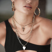 Lady wearing four Large Elongated Link Chain around her neck