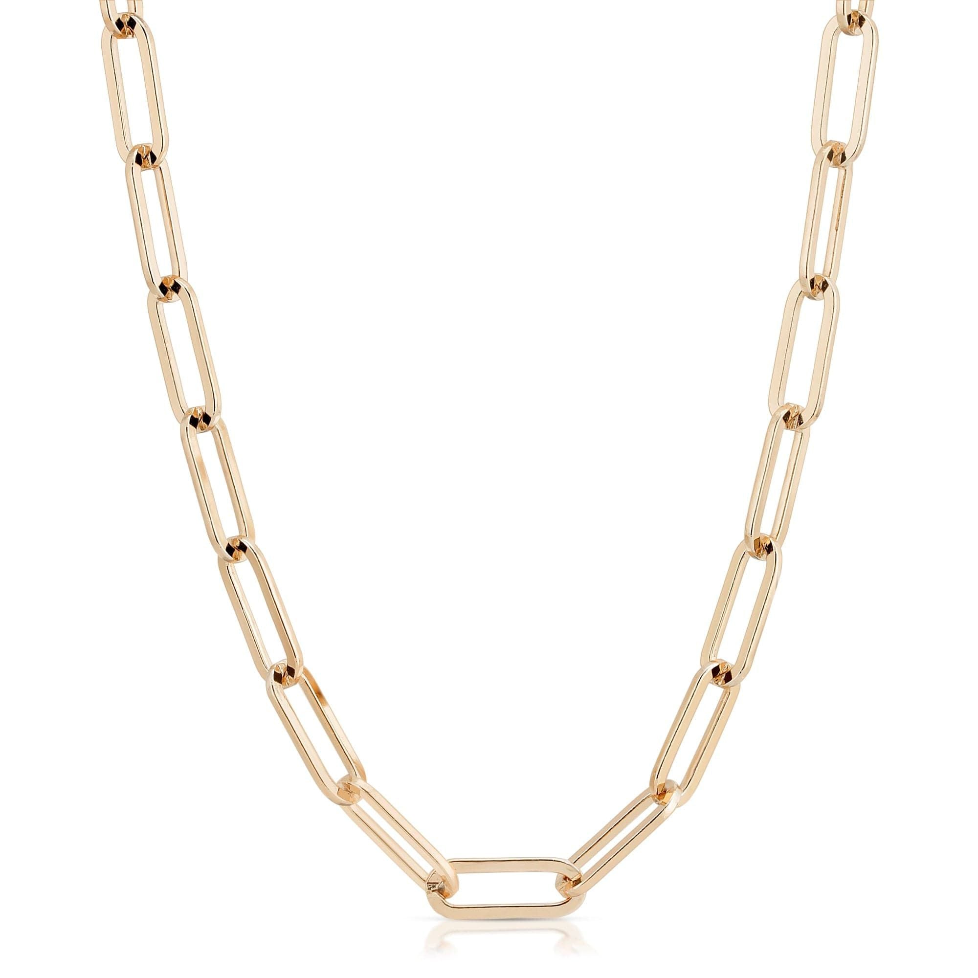 A gold-colored large elongated link chain necklace laid out on a plain background.