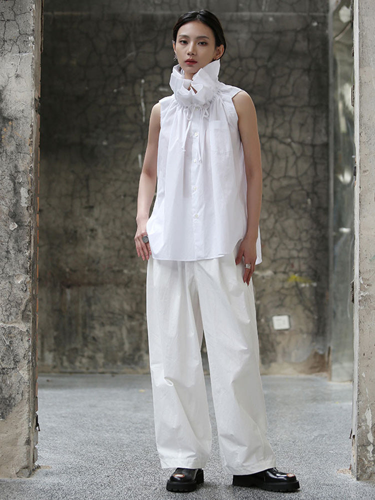 Woman wearing white short sleeve blouse