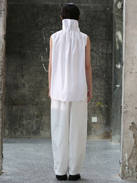 Back view of white short sleeve blouse