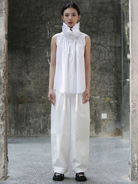 Zoom out view of white short sleeve blouse