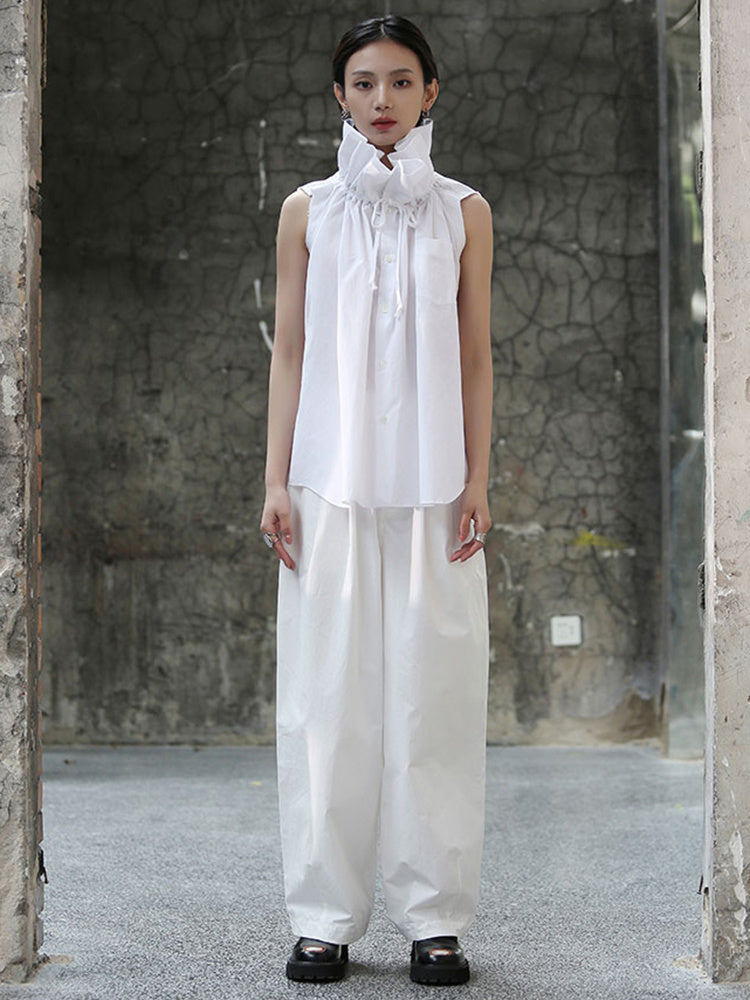 Zoom out view of white short sleeve blouse