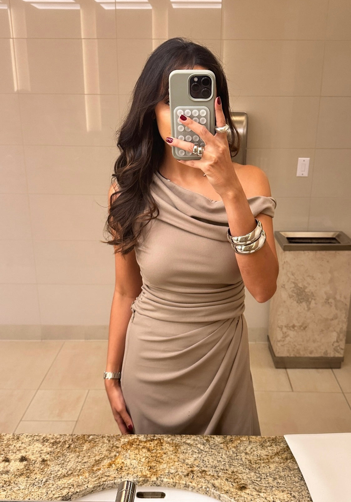 Woman in a bathroom taking a picture with Large Domed Bangle on her arm.