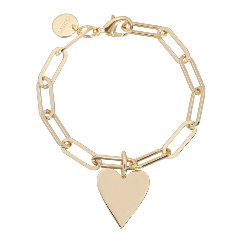 A gold-colored bracelet with a large heart charm attached to a chain.