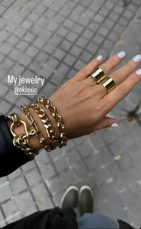 Model showing her hand with three Royal Bracelet on